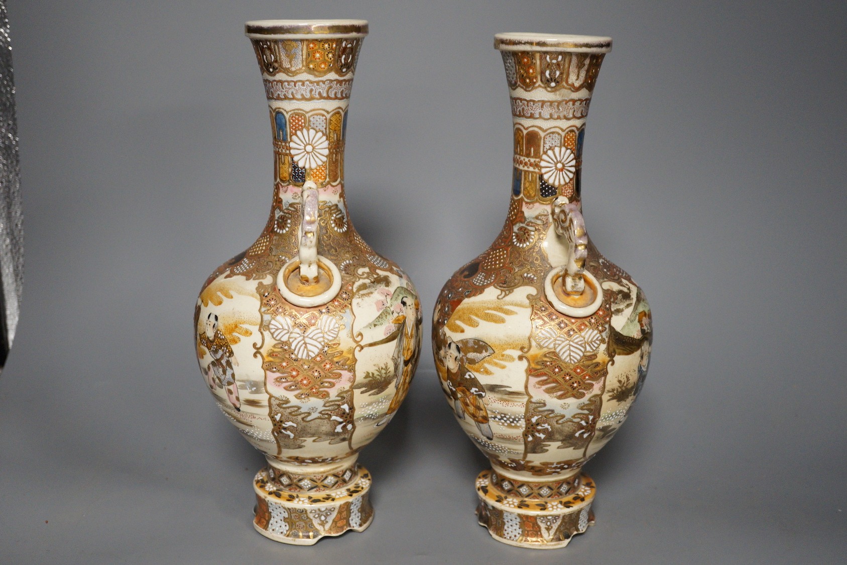 A pair of Japanese satsuma pottery vases, 30.5 cm high